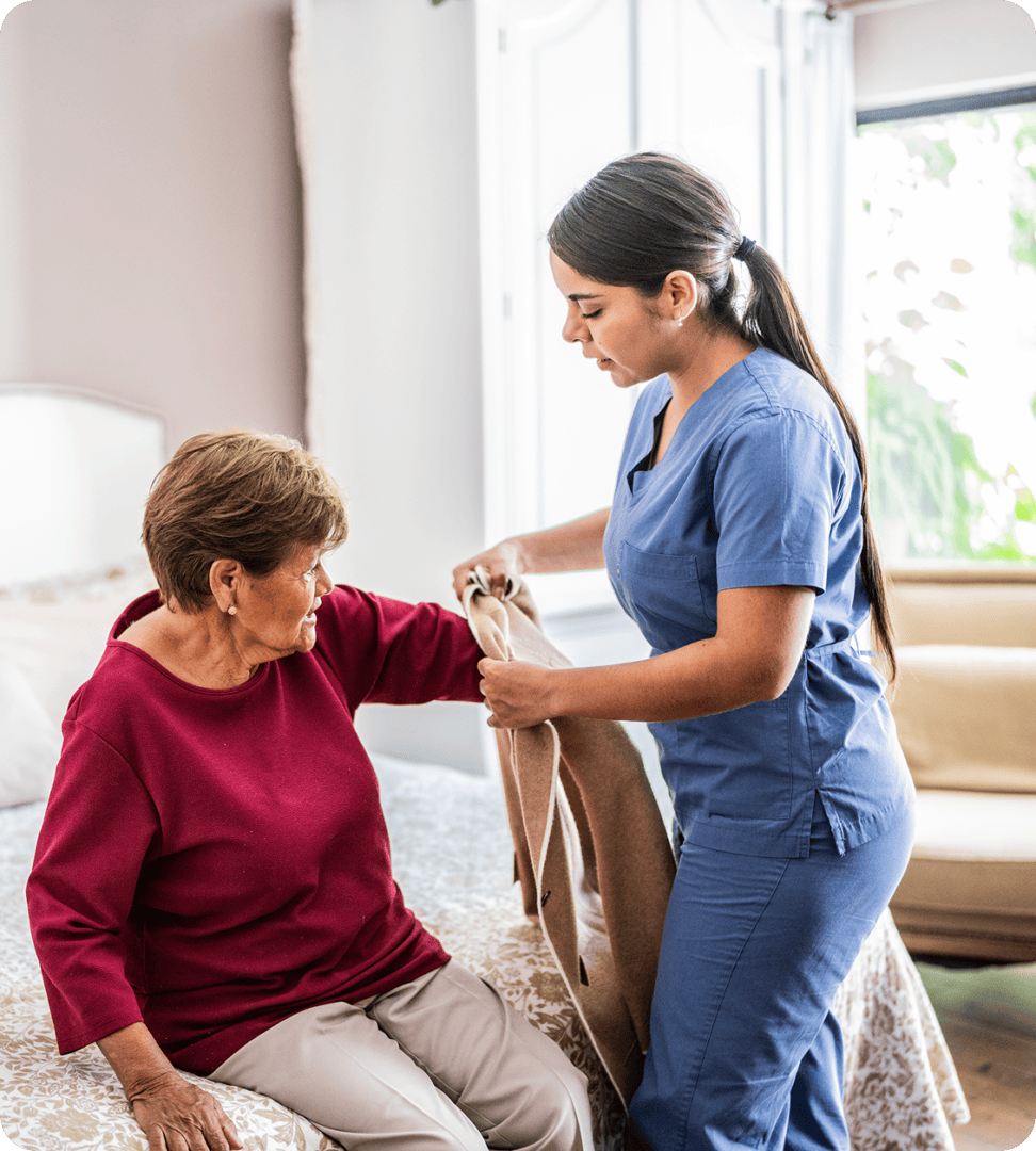 Healthcare worker aiding elderly patient