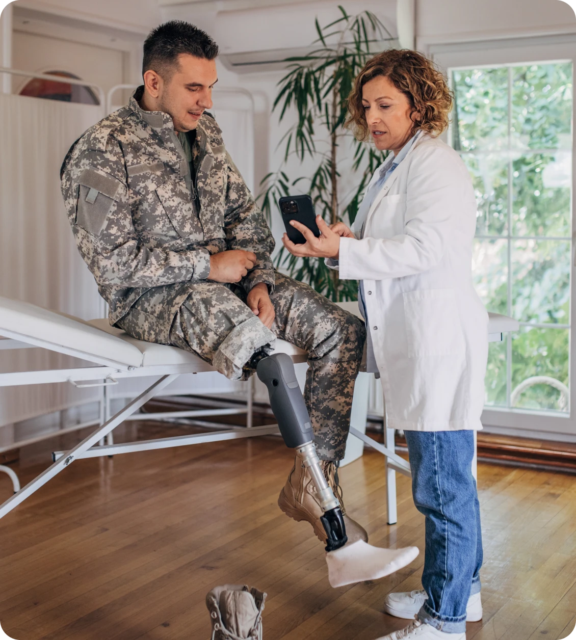 Military patient consulting with physician